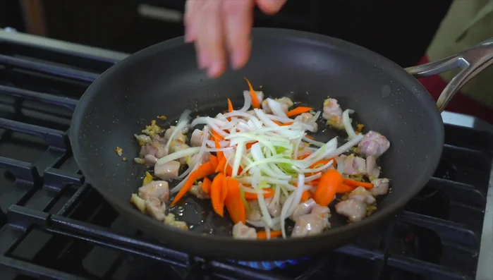 Add carrots and onions, cook for about a minute.