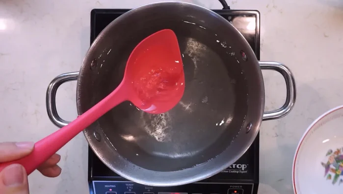 Preheat your bowl with boiling water. Empty the hot water and add 36ml (2 tbsp + 1 tsp + 1ml) of the cooled shio tare to the bowl.
