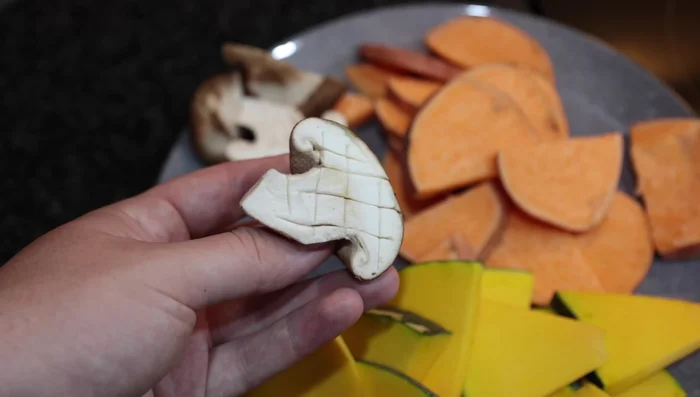 Prepare the vegetables: Slice mushrooms in half, sweet potato and pumpkin into thin slices (about 0.5 cm thick). Make small cuts to release moisture.