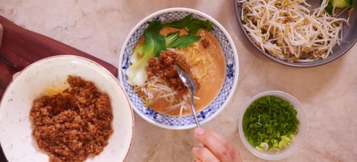 Add the pork, bok choy, bean sprouts, ramen egg (if using), green onions, sesame seeds, and shichimi togarashi. Enjoy!