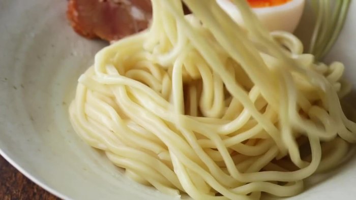 Prepare your tsukemen broth according to a separate recipe (not included in this transcript).