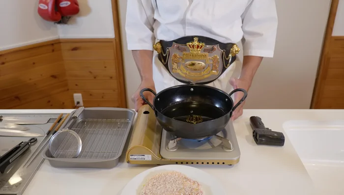 Heat rice oil in a pan to 160°C/320°F. Fry pork for 3 minutes per side, avoiding too much movement to prevent breading from coming off. Maintain oil temperature around 160°C.