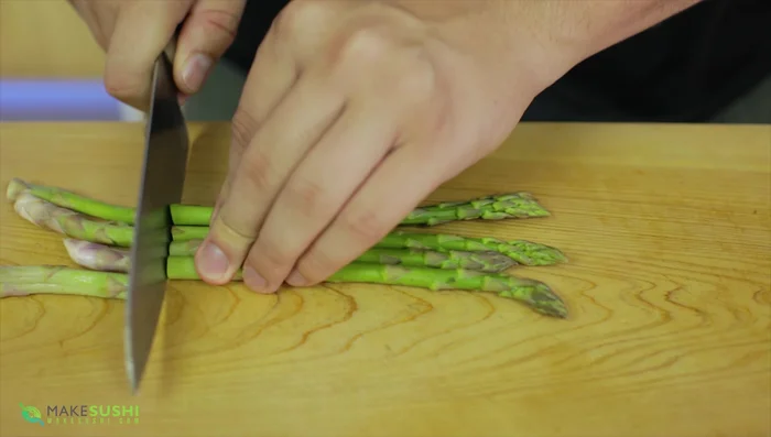 Blanch the asparagus in boiling water with salt at 90 degrees Celsius for 45-60 seconds.