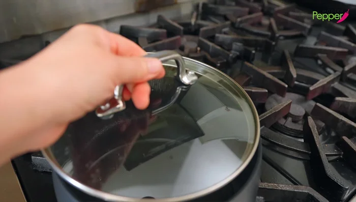 Bring 3 cups of water to a boil in a pot.