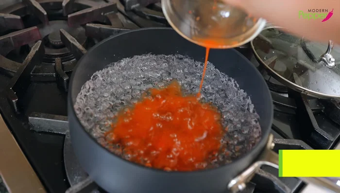 Add kimchi juice, extra fermented kimchi, garlic, and soybean sprouts. Mix well.