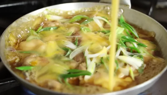 Add the beaten egg and cook for 10 seconds, swirling the pan.