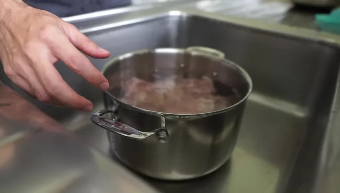 Pre-boil bones for several minutes, skimming off scum until only white scum remains.