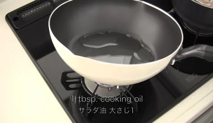 Heat one tablespoon of cooking oil in a frying pan. Cook the chopped onion until tender.