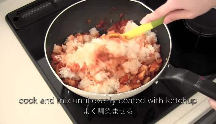 Add warm cooked rice and cook until evenly coated with ketchup. Season with salt and pepper.