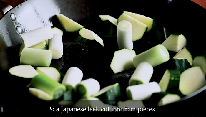Cook the vegetables: Heat oil in a large pan over medium heat. Add zucchini, leek, and bell pepper. Cook until slightly charred, turning occasionally.