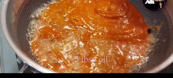 Add the blended chili paste to the pan and fry until the oil separates.
