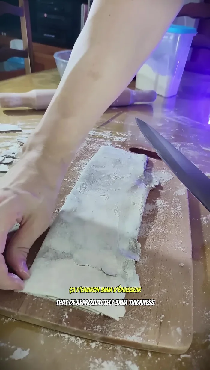 Place the dough on a cutting board and cut it into 3mm thick strips.