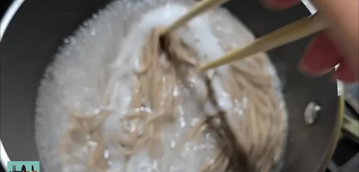 Boil soba noodles until al dente (usually a few minutes).