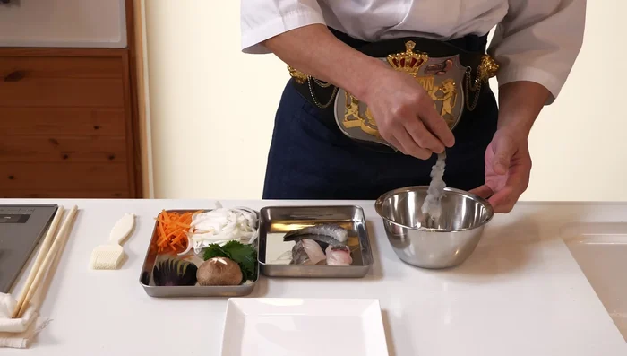 Coat ingredients in flour, brushing off excess. Dip in tempura batter.