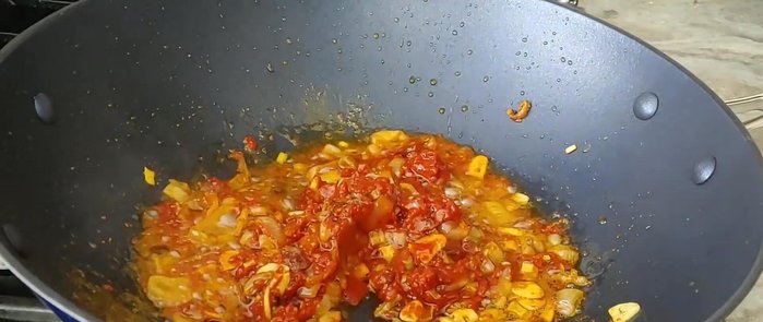 Add blended tomatoes and pepper. Let it simmer for about 20 minutes, stirring frequently. The sauce will thicken.