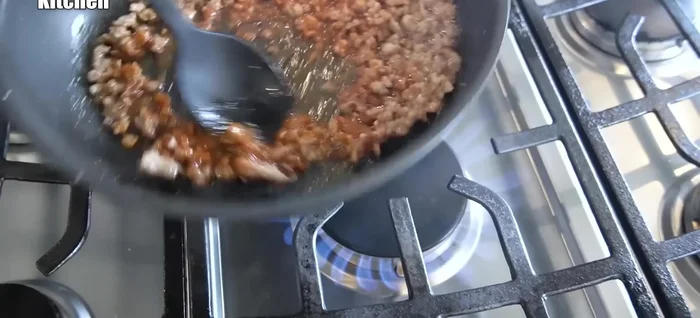 Add the prepared seasonings to the pork and stir-fry until well combined.