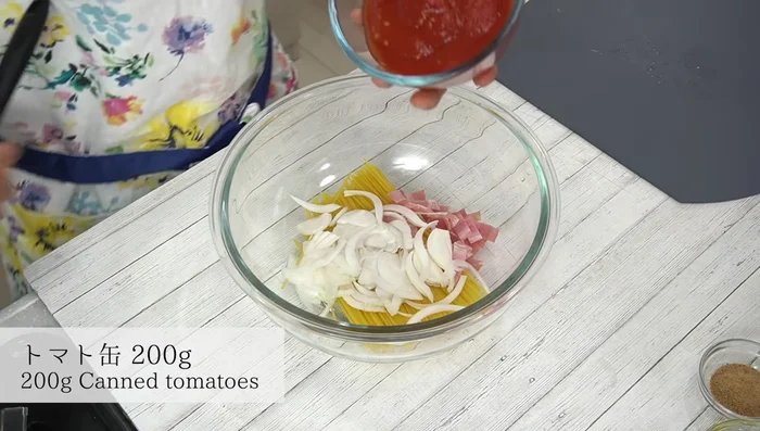 Add canned tomatoes, grated ginger, ketchup, Worcestershire sauce, sugar, and olive oil.