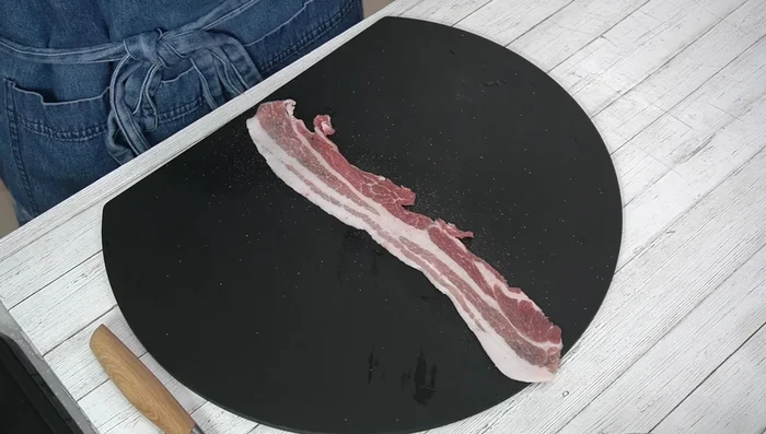 Lightly dust pork belly with potato starch.