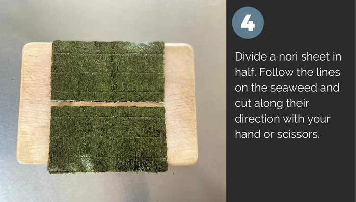 Cut nori sheet in half lengthwise. Cut along the lines on the seaweed using hands or scissors.