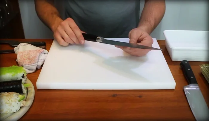 Sharpen your knife using a wet stone to maintain its extreme sharpness. A sharp knife is crucial for clean, precise cuts.