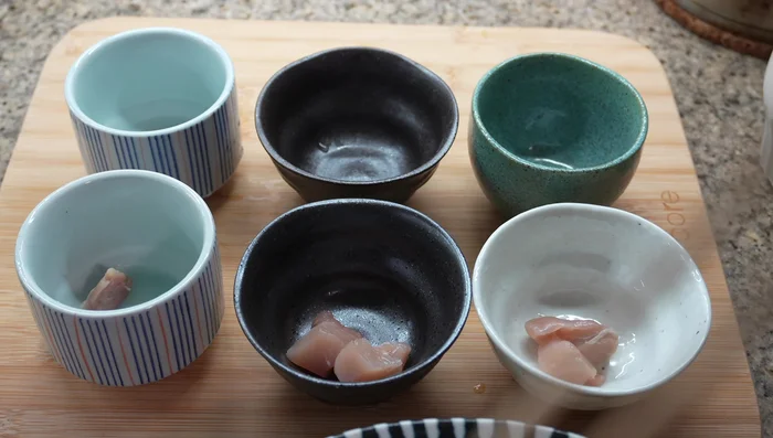 Assemble in small cups: Layer chicken, mushrooms, and kamaboko in each cup. Pour in the egg mixture. Use a skewer to remove bubbles. Top with mitsuba and cover with aluminum foil.