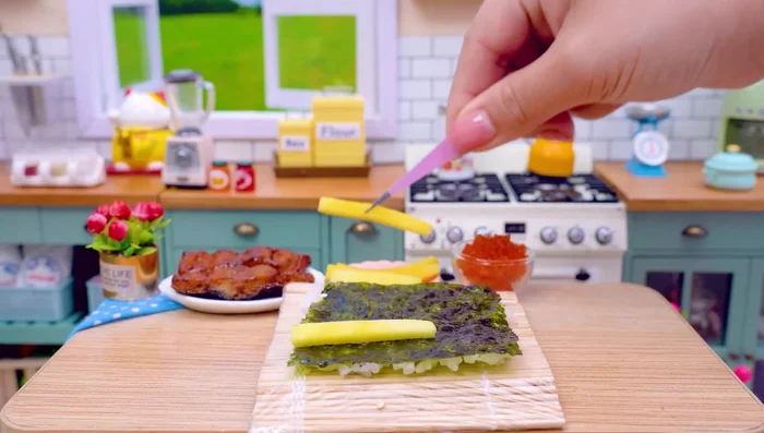Add avocado, crab stick, and salmon egg.
