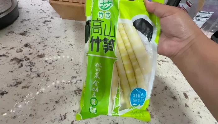 Prepare the bamboo shoots by slicing them thinly and optionally soaking them in water.
