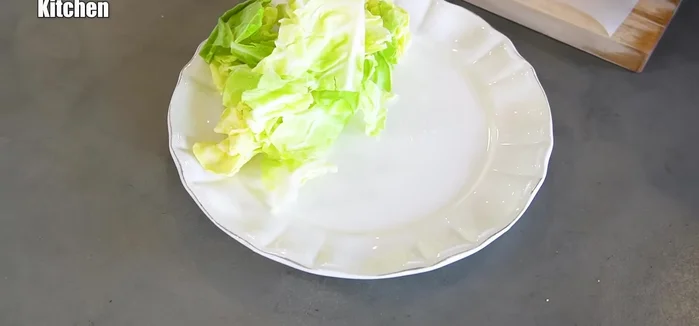 Plate and serve: Plate the finished Yamazokuyaki with the torn cabbage, garnish with lemon if desired.