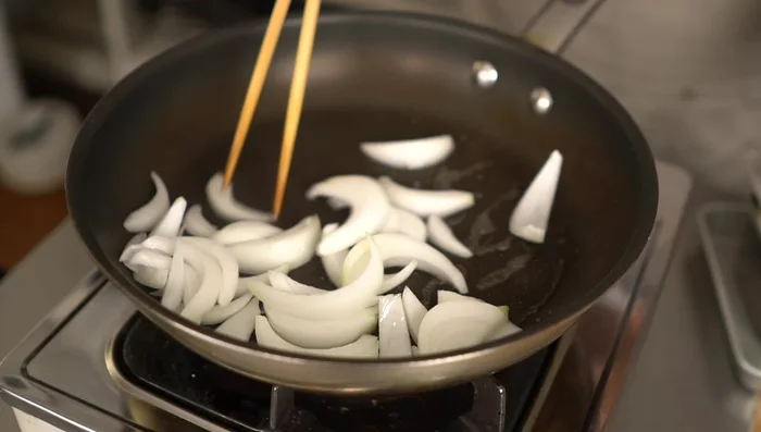 Remove onions and set aside. Fry chicken until lightly browned on both sides.