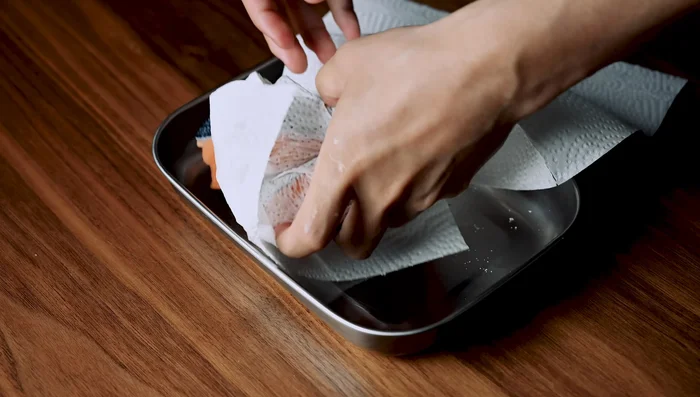 Pat salmon fillets dry with paper towels. Season both sides generously with salt and let them rest for 20 minutes (or 10 minutes if your kitchen is warm, or refrigerate for 5 minutes).