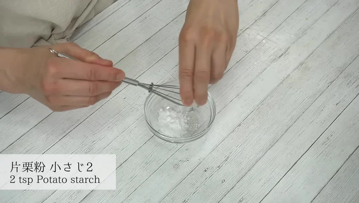 Mix potato starch with water to create a slurry.
