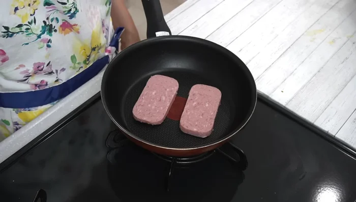 Grill Spam in a pan over medium heat until browned on both sides.