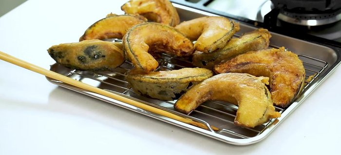 Place the coated pumpkin on a grill to drain excess oil. Don't overlap them too much.