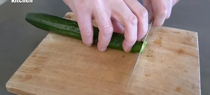 Wash and thinly slice the cucumber. The thinner the better for mixing with the soup and noodles.
