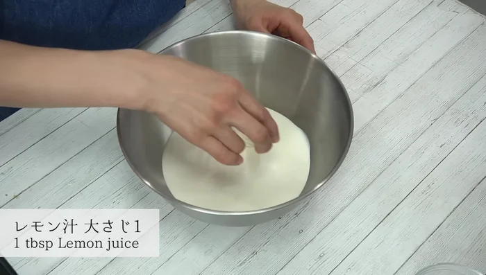 In a separate bowl with ice water, whip cream and lemon juice until stiff peaks form.