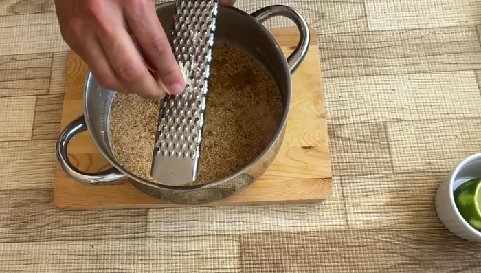 Add minced garlic, grated ginger, and lemon juice.