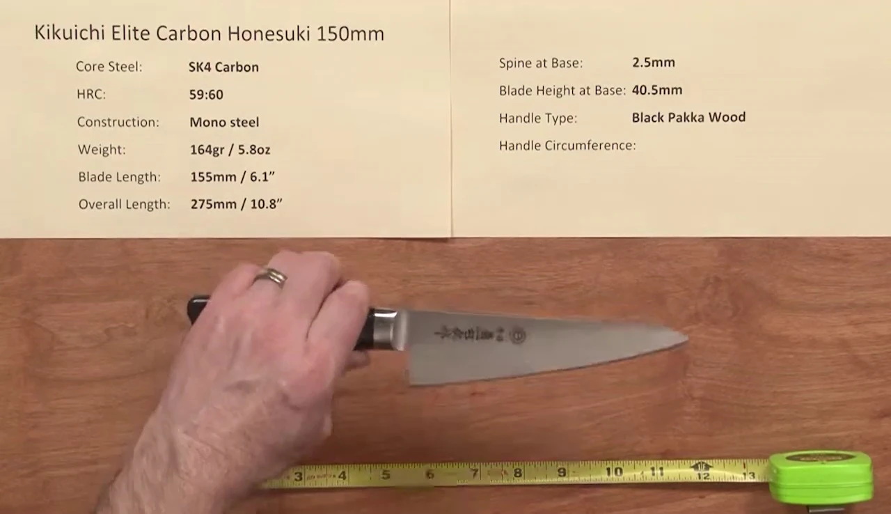The knife's mono-steel construction is highlighted.