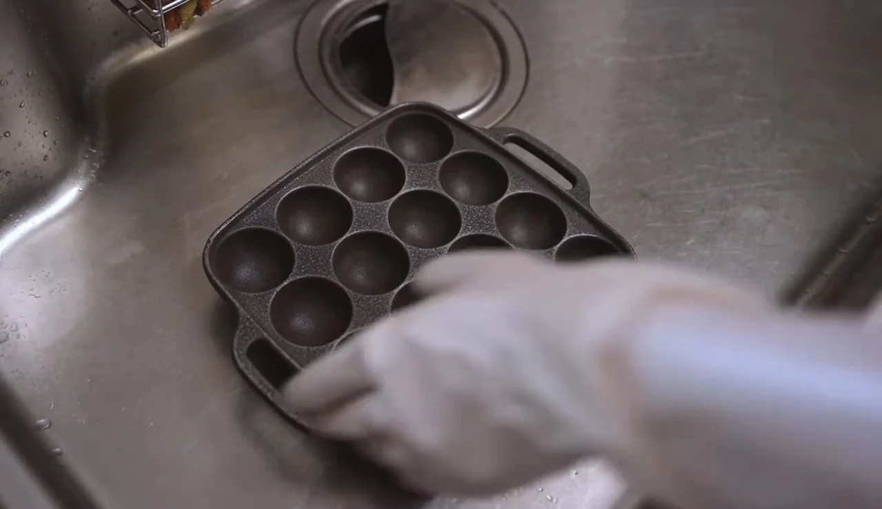 Takoyaki cooking on the grill plate